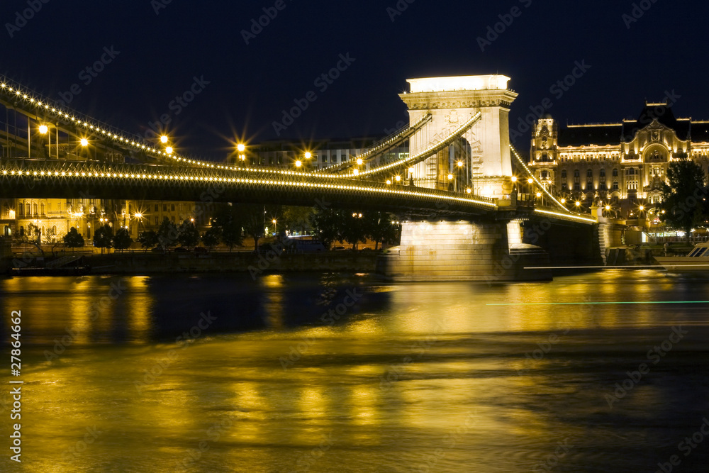Obraz premium Budapest bridge illuminated at night..