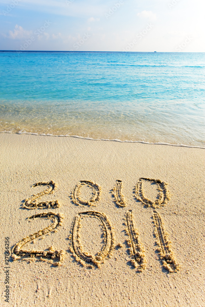 Fototapeta premium On sand at ocean edge it is written 