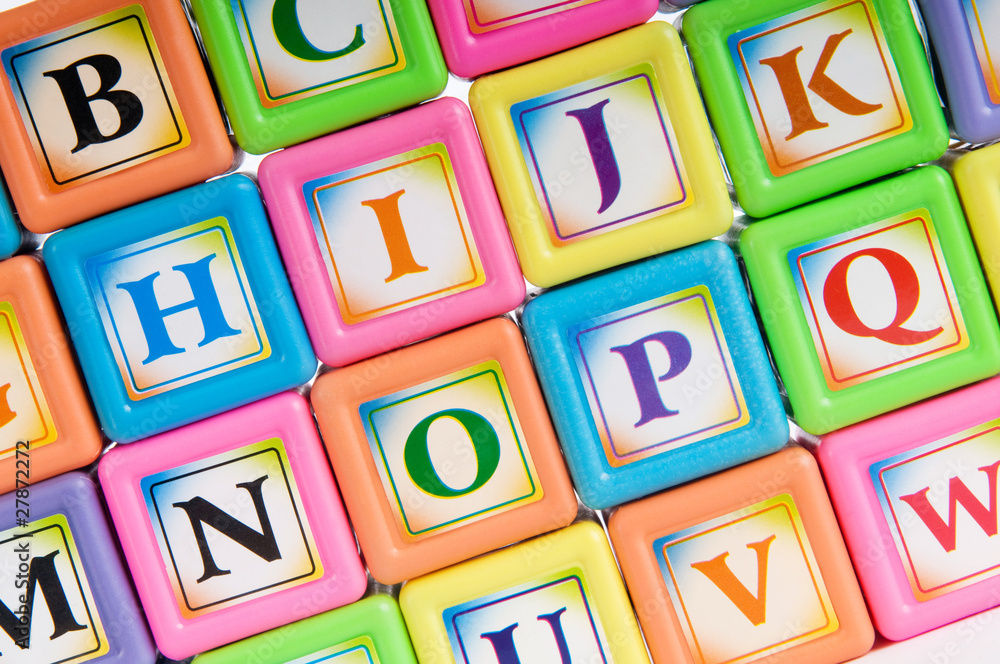 Learning and education concept - pile of alphabet blocks Learning and education concept - pile of alphabet blocks