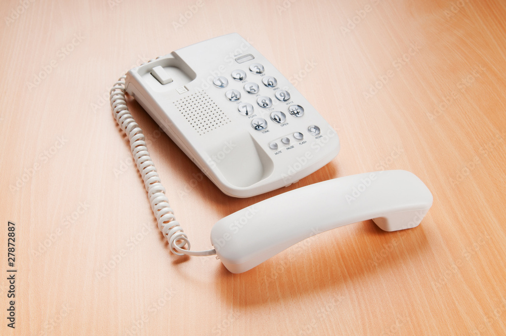 White office phone on the flat surface White office phone on the flat surface