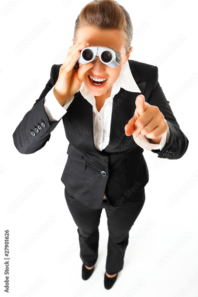 Business woman with binoculars and pointing finger at you Business woman with binoculars and pointing finger at you
