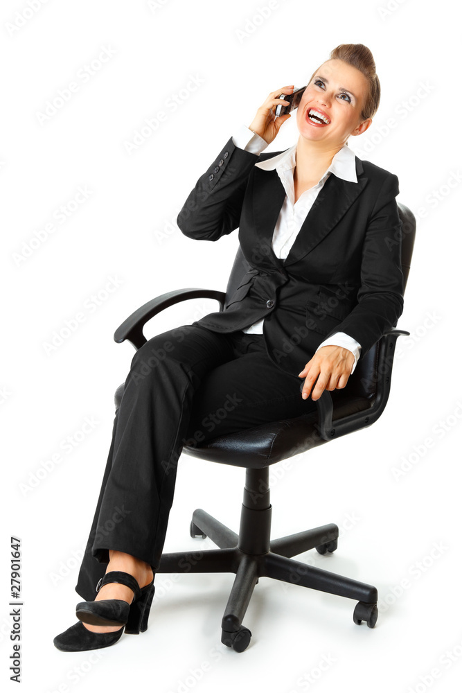 Successful business woman sitting on chair and talking on phone Successful business woman sitting on chair and talking on phone