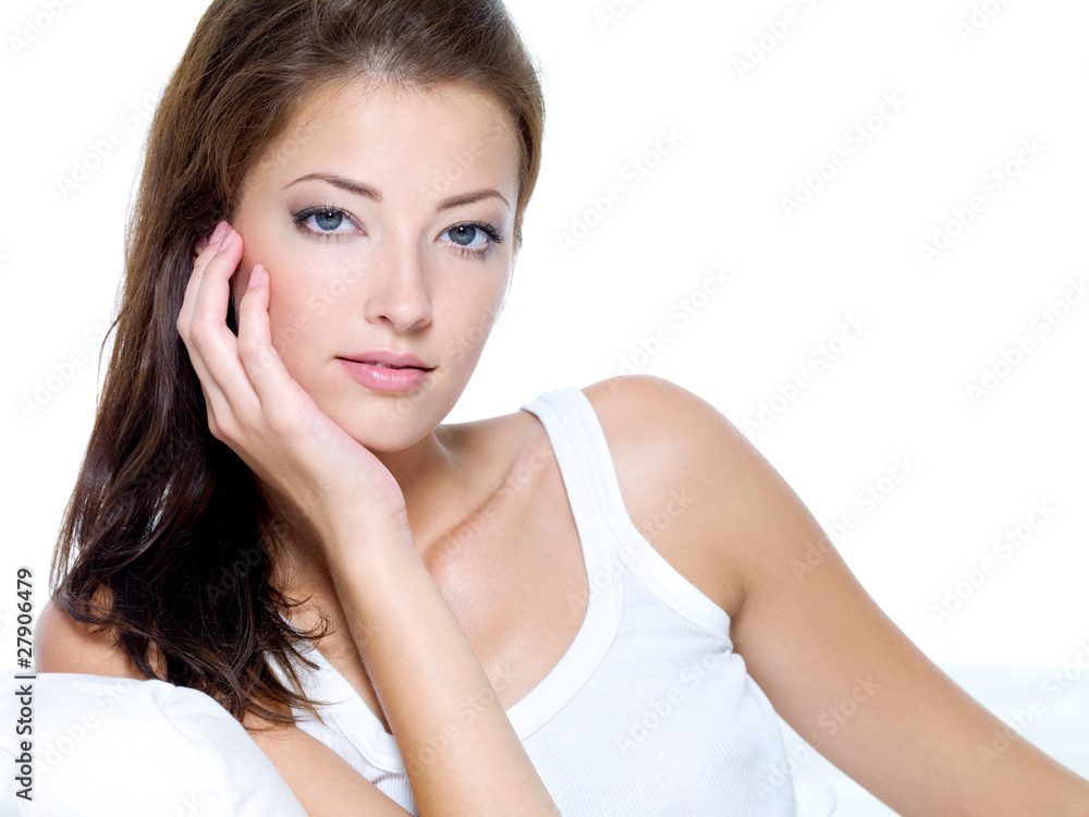beautiful woman with clean skin sitting on sofa beautiful woman with clean skin sitting on sofa