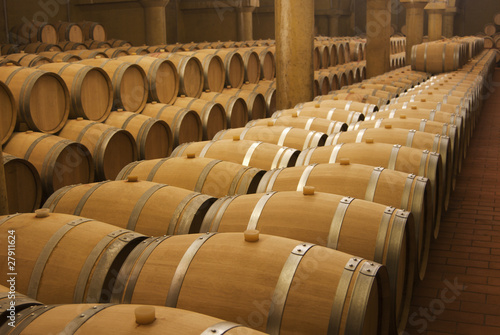 Wine barrels in cellar photo