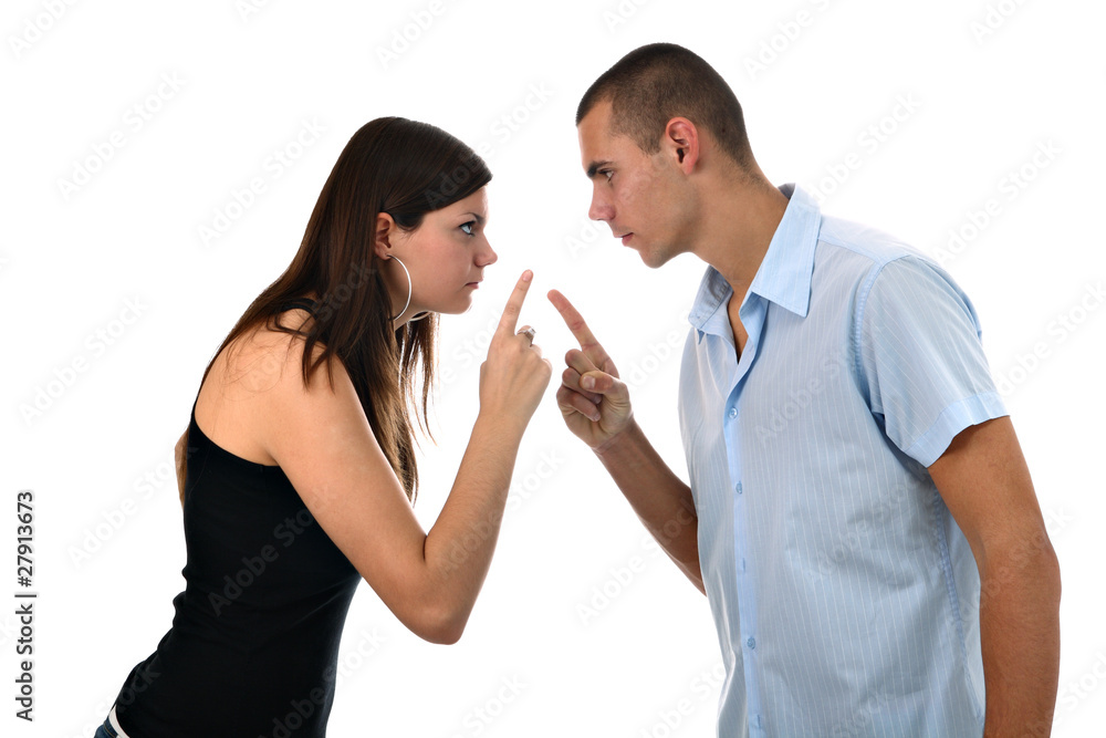 Young couple pointing fingers at each other isolated on white Young couple pointing fingers at each other isolated on white