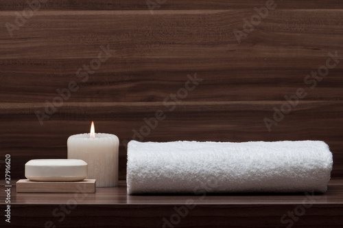 arrangement of soap, towel and candle photo