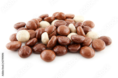 pile of chocolate gingernuts, pepernoten over white background