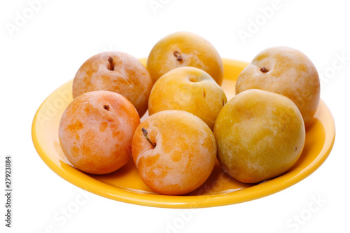 Yellow plums on a plate