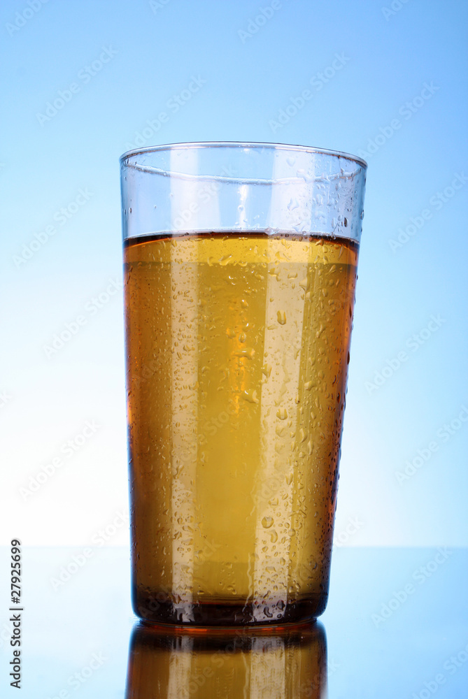 Cup of beer on blue background Cup of beer on blue background