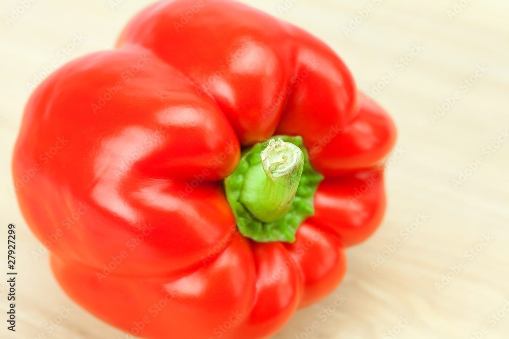 red pepper on a cutting board isolated on white red pepper on a cutting board isolated on white