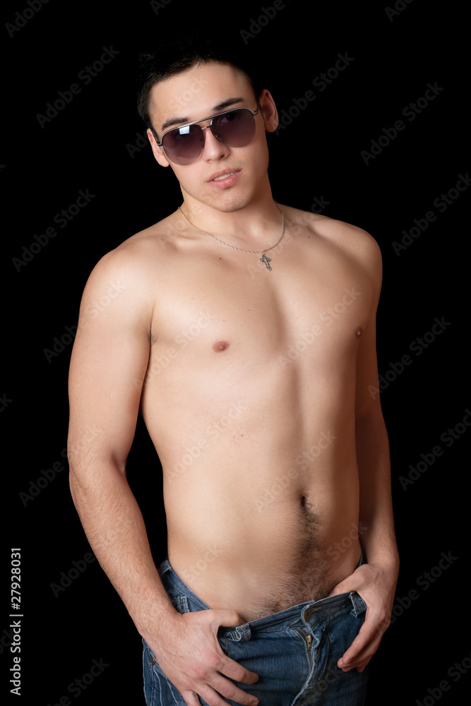 Fototapeta premium Portrait of young man in sanglasses. Isolated