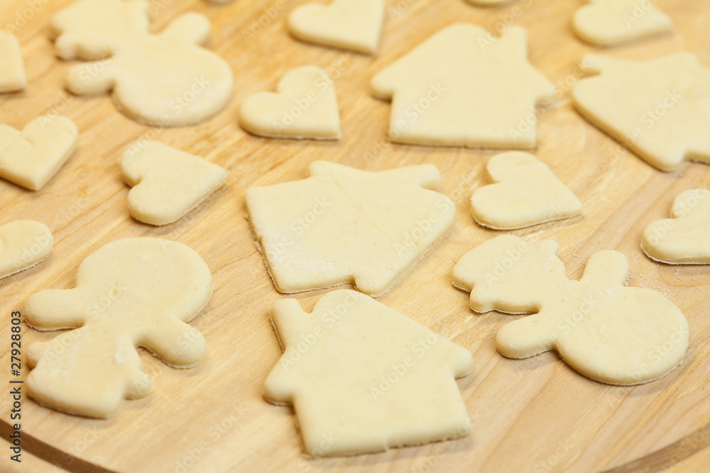 cut in the dough snowman, heart, and  house