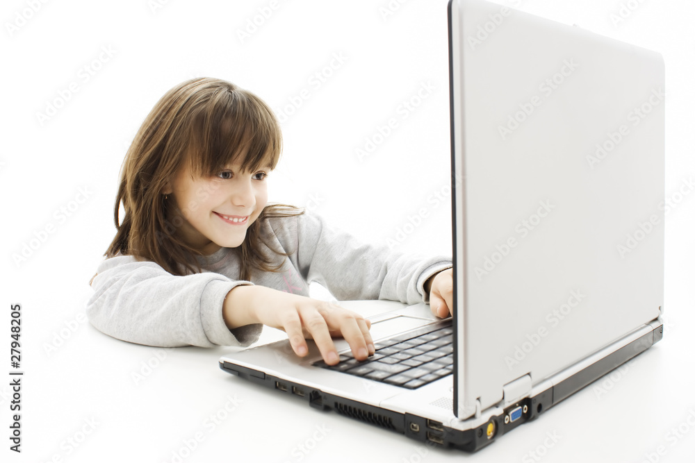 Beautiful little girl with laptop computer . Beautiful little girl with laptop computer .