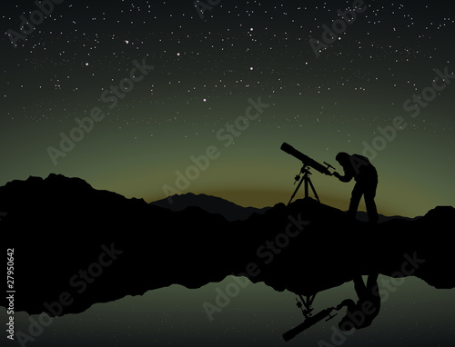 Looking at the stars through a telescope photo