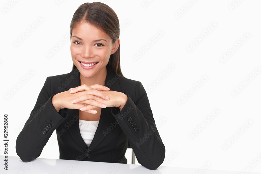Young businesswoman sitting at desk Young businesswoman sitting at desk