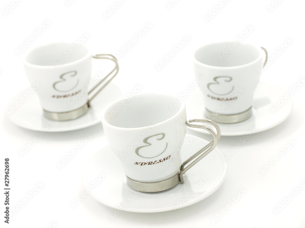 Espresso coffeé cups, on plates, towards white Espresso coffeé cups, on plates, towards white