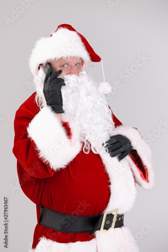 Santa talking on mobile looking at camera © nyul