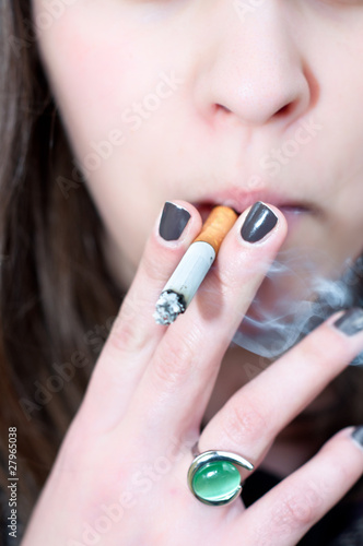 Close-up of a girl holding cigarett