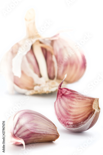 Bulbs of organic garlic, isolated over white. Shallow DOF