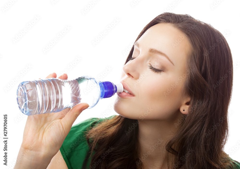 Woman drinking water from bottle, isolated on white Woman drinking water from bottle, isolated on white