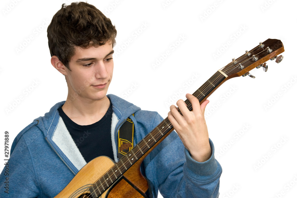 Teenager playing acoustic guitar on white background Teenager playing acoustic guitar on white background