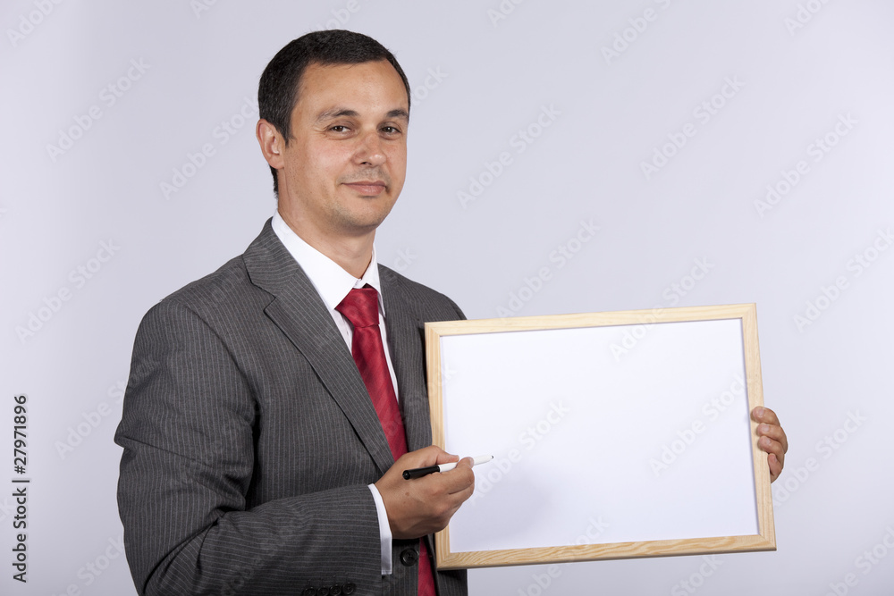 businessman holding a whiteboard businessman holding a whiteboard