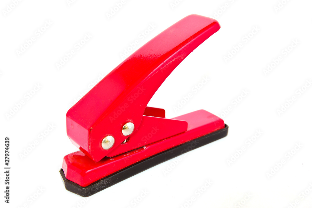 red office paper punch isolated red office paper punch isolated
