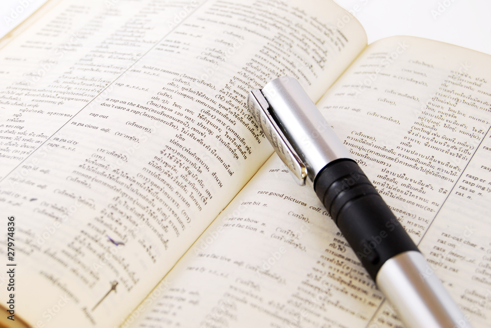 closeup of old dictionary pen closeup of old dictionary pen
