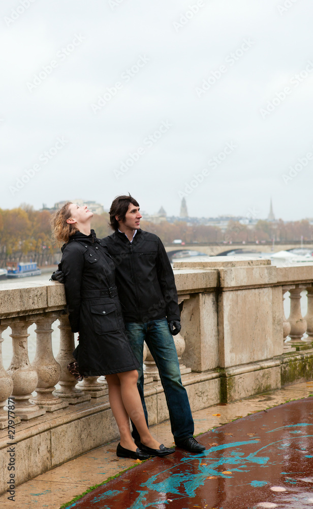 Dating couple in Paris at rainy weather