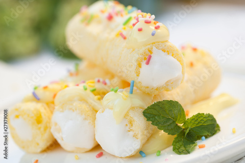 cream roll with vanilla cream and colored sugar streusel