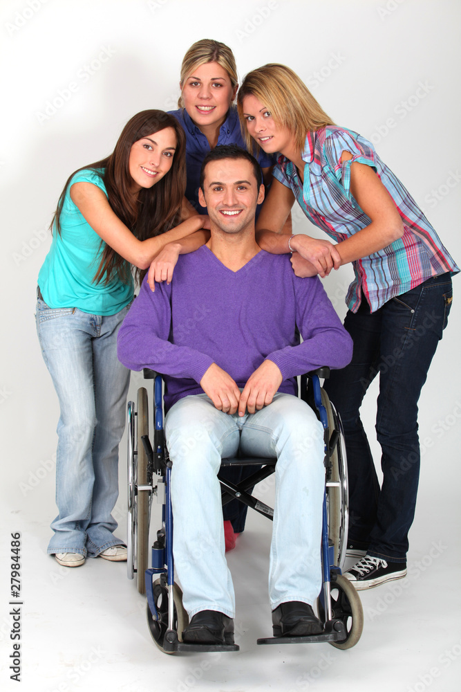 Young man in wheelchair with group of girl friends Young man in wheelchair with group of girl friends