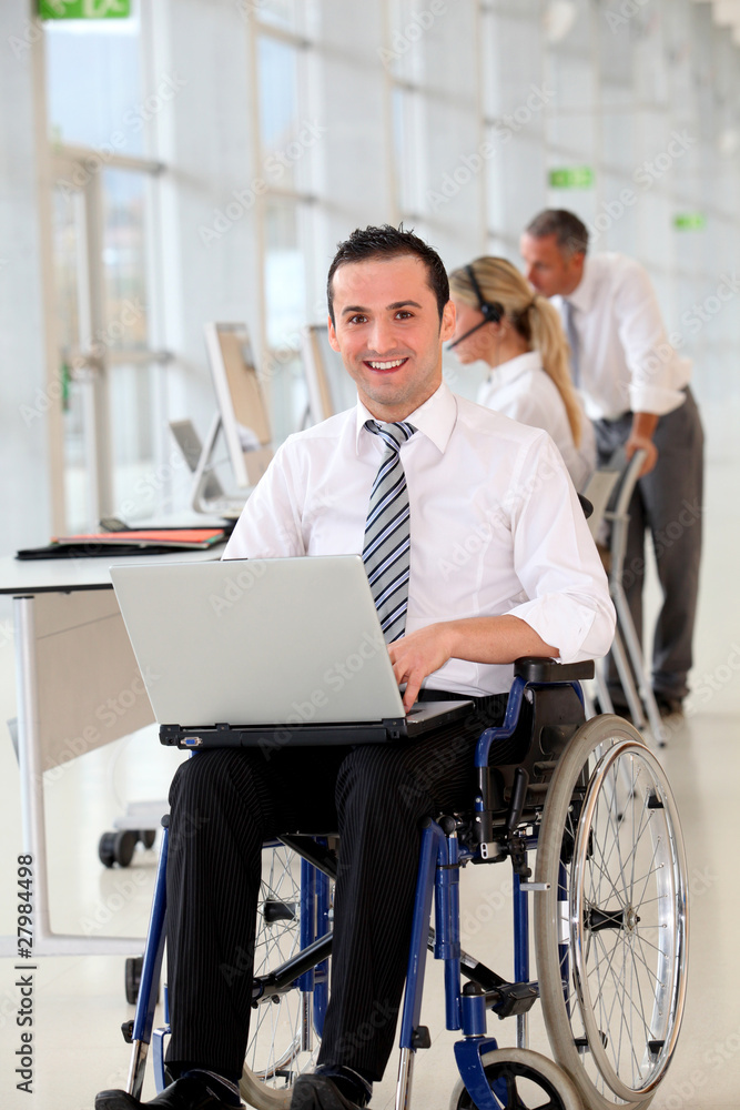 Office worker in wheelchair Office worker in wheelchair