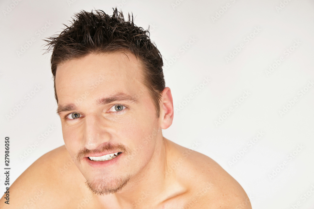 Portrait of young smiling man. You can write text on right side. Portrait of young smiling man. You can write text on right side.
