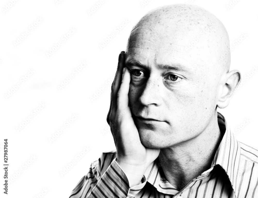 high contrast dark moody business man portrait in his 30's on wh