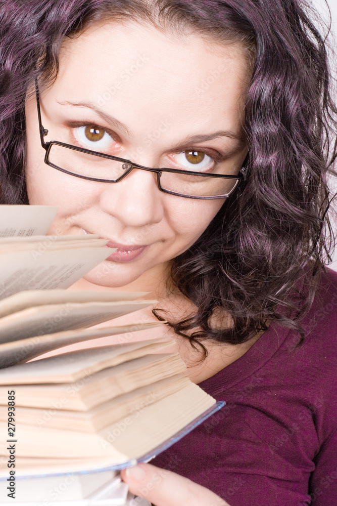woman with stack of books woman with stack of books