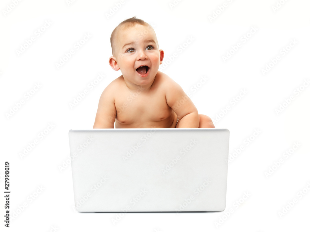 Surprised baby boy using a laptop computer Surprised baby boy using a laptop computer