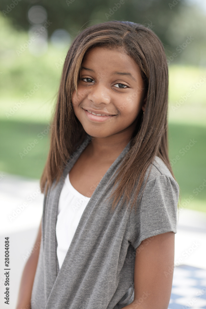 Young African american child smiling in the park Young African american child smiling in the park