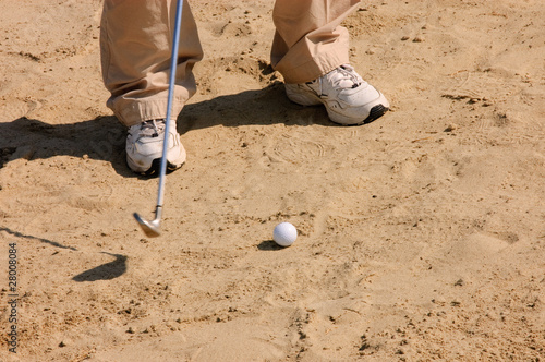 golfer in a sandtrap photo