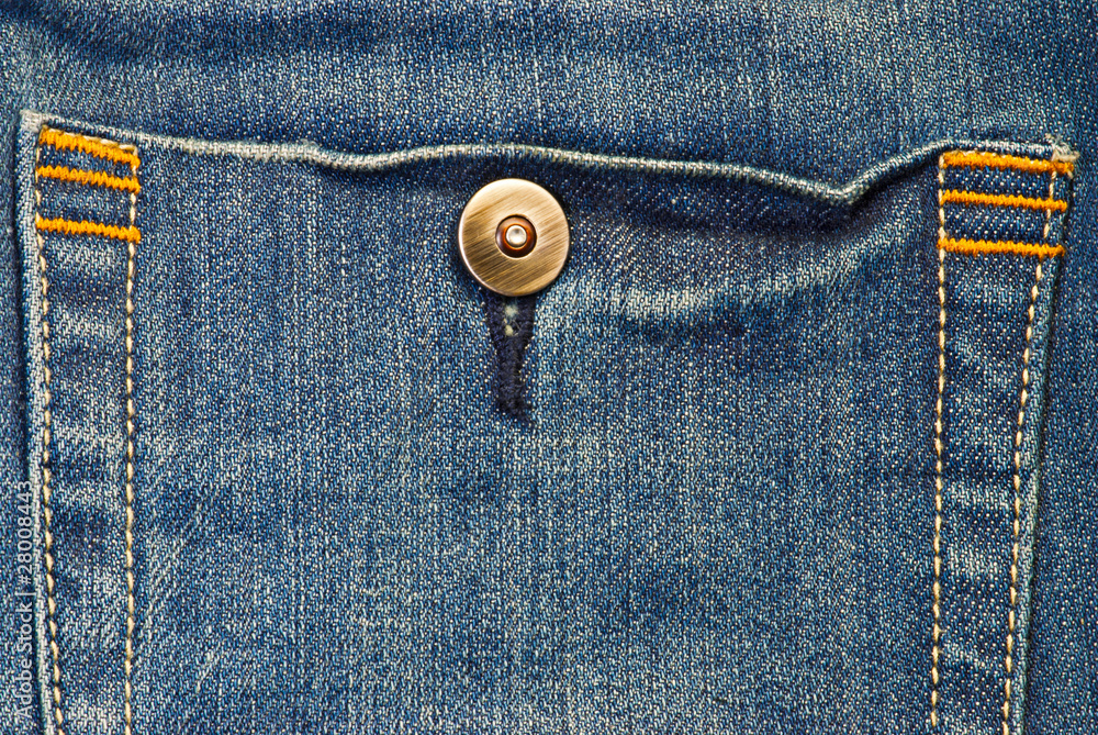 Macro blue jeans background with button Macro blue jeans background with button