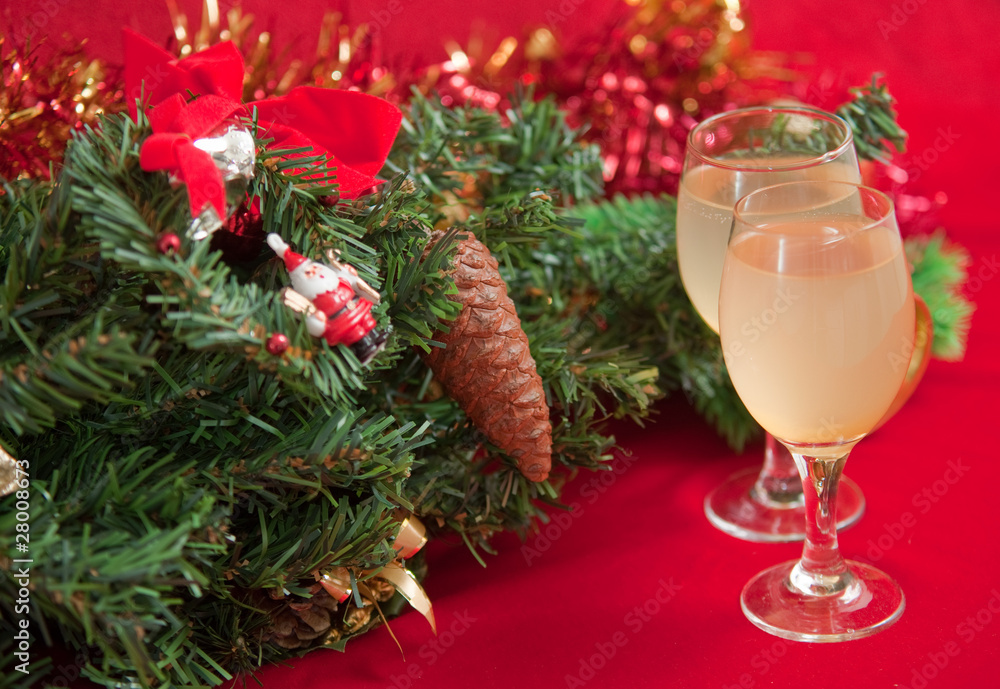 Christmas tree and glasses of wine . Christmas tree and glasses of wine .