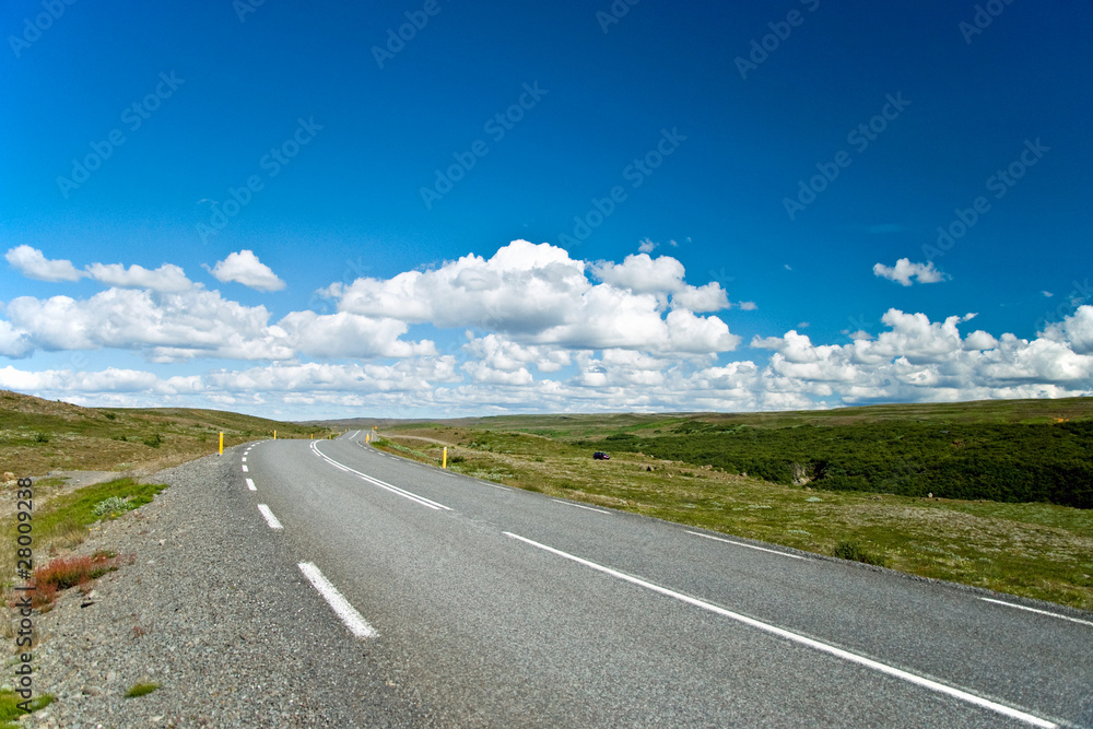 Empty road with a beautiful blue sky in horizon