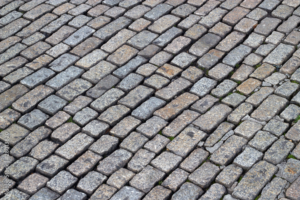 Old English cobblestones road close up.
