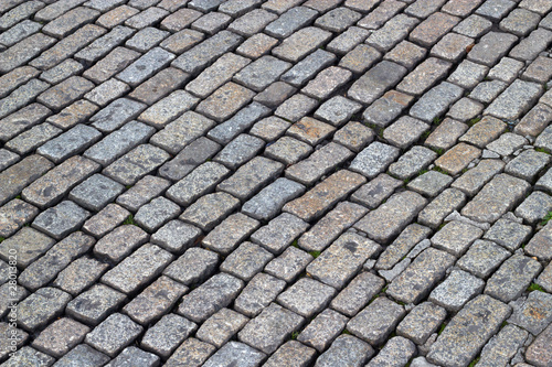 Old English cobblestones road close up.