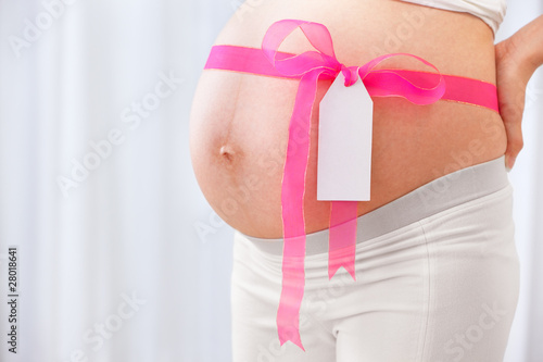 Wallpaper Mural Pink ribbon arround pregnant lady's stomach Torontodigital.ca