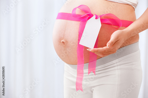 Wallpaper Mural Pink ribbon arround pregnant lady's stomach Torontodigital.ca