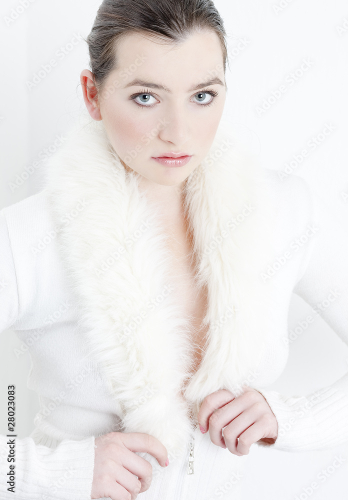 portrait of young woman wearing white sweater