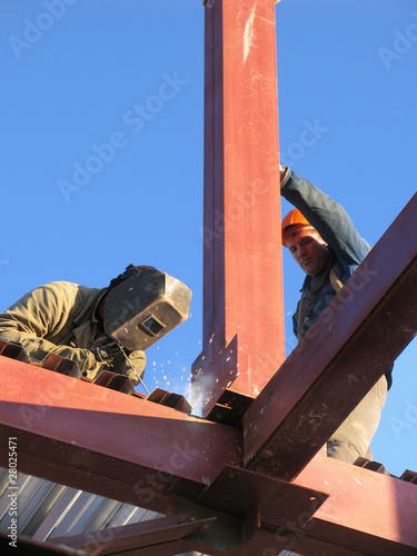 Welders working on construction site