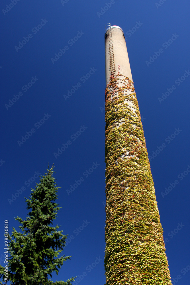 High chimney in a blue sky in denmark