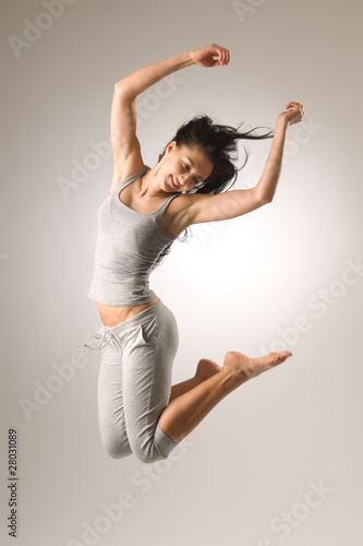 Fototapeta Naklejka Na Ścianę i Meble -  Jumping Attractive Girl