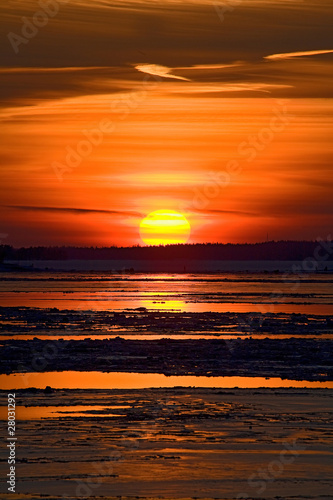 Sunset and ice floe on sea